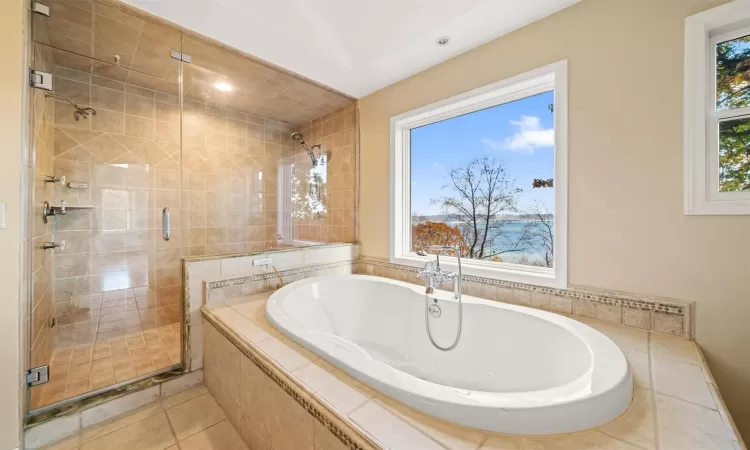 Primary En-Suite Bathroom with walk-in shower and Soaking Tub