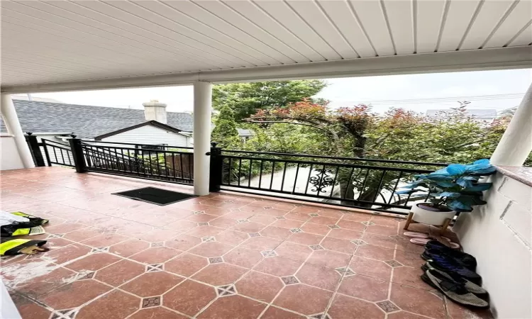 View of patio featuring a balcony