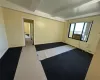 Spare room with beam ceiling and carpet floors