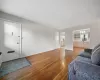 Living room featuring an inviting chandelier and hardwood / wood-style flooring