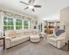 Living room open floor plan to kitchen featuring Carpeting & ceiling fan