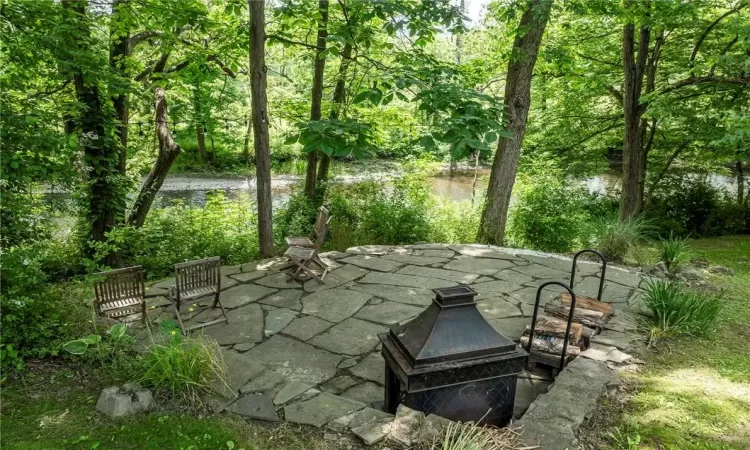 View of bluestone patio overlooking creek