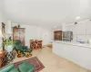 Living room featuring sink and light hardwood / wood-style floors