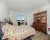 Bedroom with light hardwood / wood-style flooring