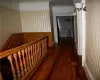 Hallway featuring ornamental molding and hardwood / wood-style floors