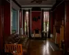 Living room featuring ceiling fan, ornamental molding, and parquet floors