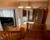 Entrance foyer with crown molding, a chandelier, and light parquet floors