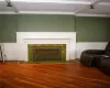 Living room with beam ceiling, coffered ceiling, and hardwood / wood-style flooring