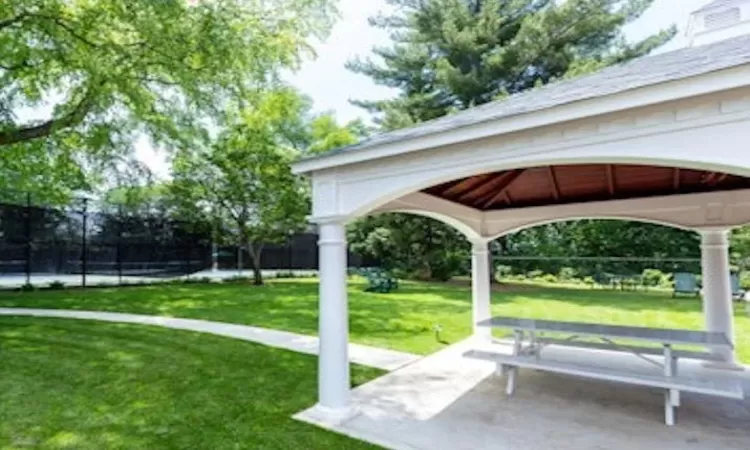 View of property's community with a yard and a gazebo