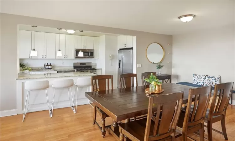 Dining area featuring light hardwood / wood-style flooring