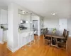 Dining area with light wood-type flooring