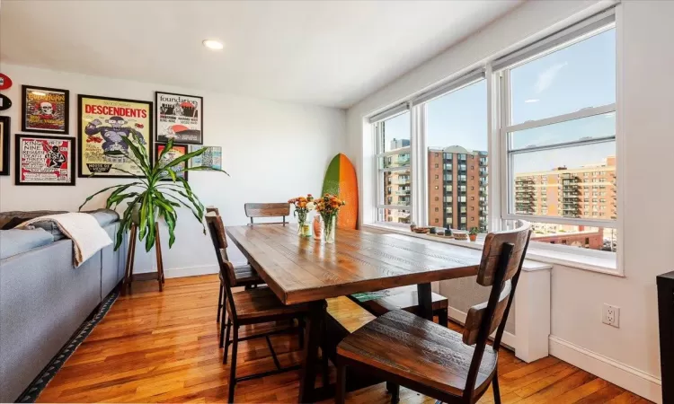 Dining area with light hardwood / wood-style floors