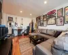 Living room with wood-type flooring