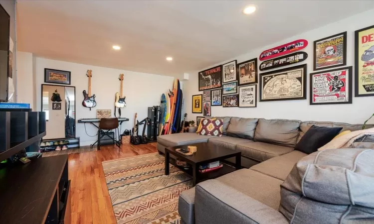 Living room with wood-type flooring