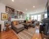 Living room with hardwood / wood-style flooring