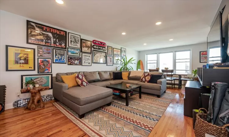 Living room with hardwood / wood-style flooring