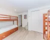 Bedroom featuring a closet and light hardwood / wood-style floors