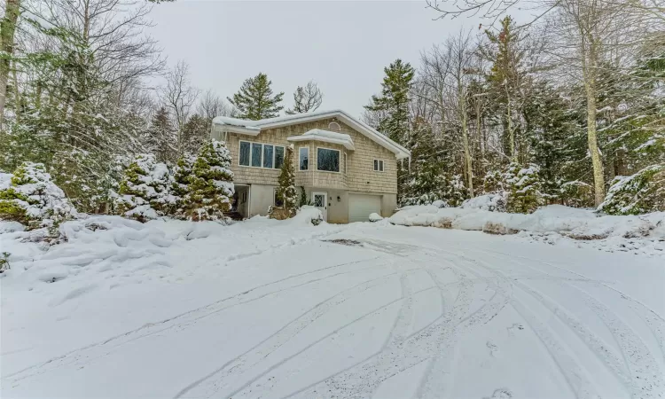 View of front facade featuring a garage