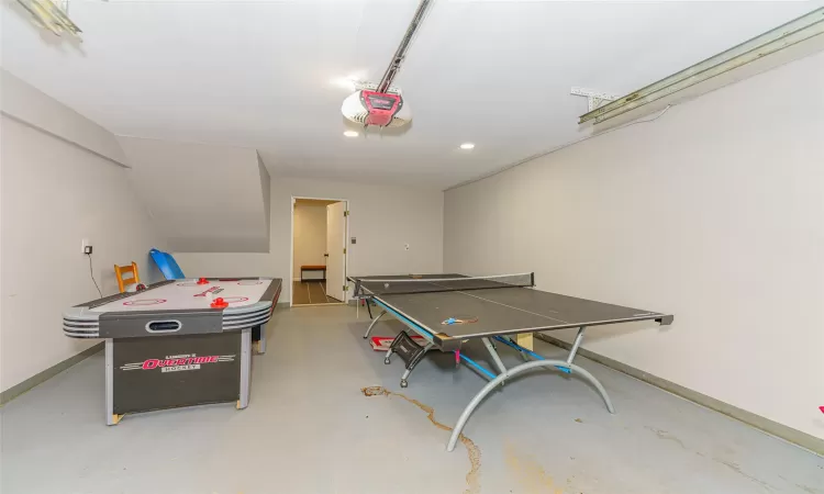 Rec room with concrete flooring