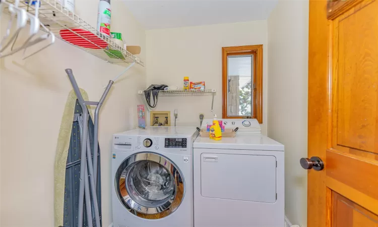 Laundry room featuring washer and clothes dryer