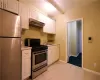 Bathroom featuring vanity and shower / bathtub combination with curtain