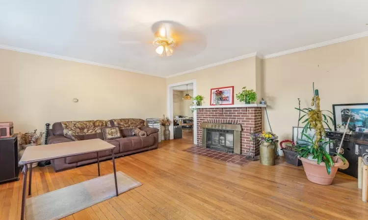 Home office with wood-type flooring and ornamental molding