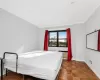 Bedroom with parquet floors and ornamental molding