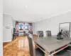 Dining space featuring ornamental molding and light parquet flooring