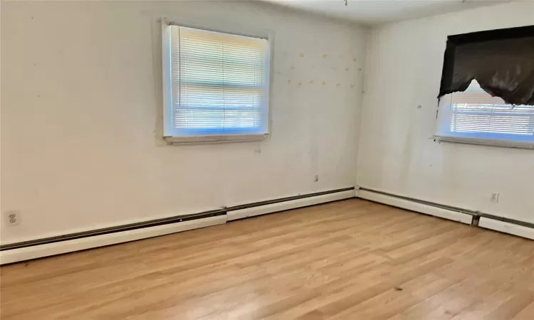 Unfurnished room with light wood-type flooring