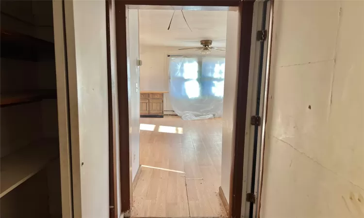 Hall featuring light wood-type flooring