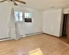 Spare room with light hardwood / wood-style flooring and ceiling fan