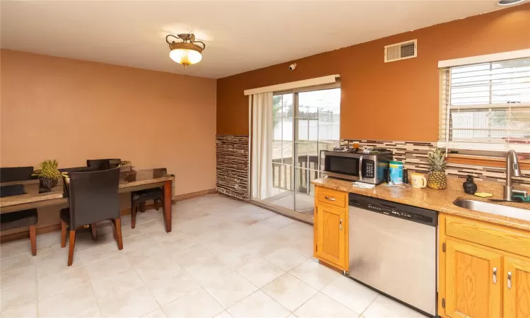 Dining area with slider to deck.