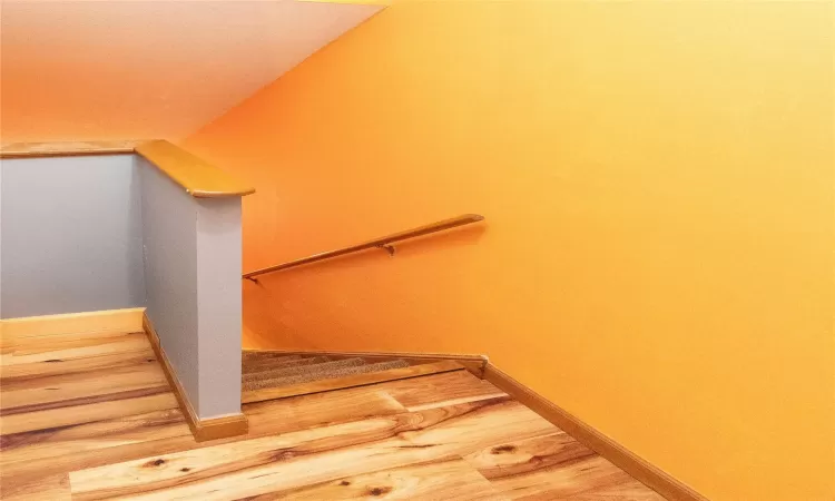 Stairway to go into living room.  Washer and dryer to left.