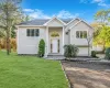 Split foyer home featuring a front yard