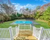 View of pool featuring a lawn