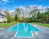 View of pool featuring a yard