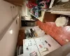 Kitchen featuring refrigerator and dark tile patterned floors