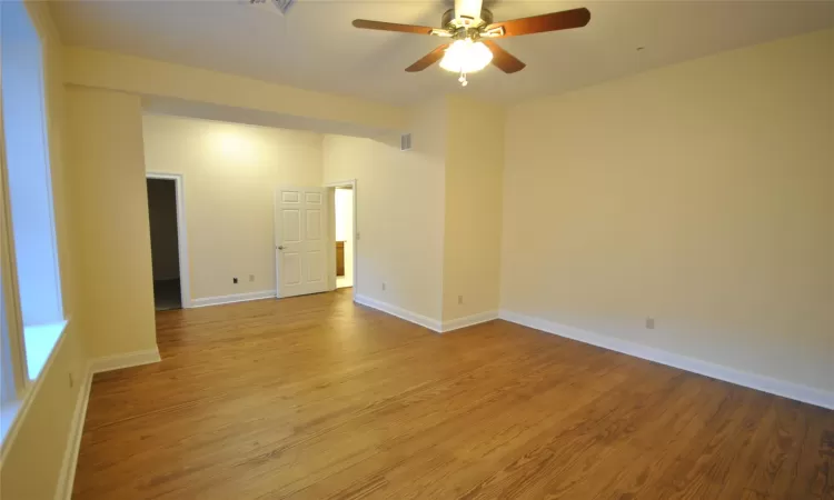 Spare room with ceiling fan and light hardwood / wood-style flooring