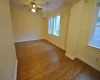 Unfurnished room featuring hardwood / wood-style floors and ceiling fan