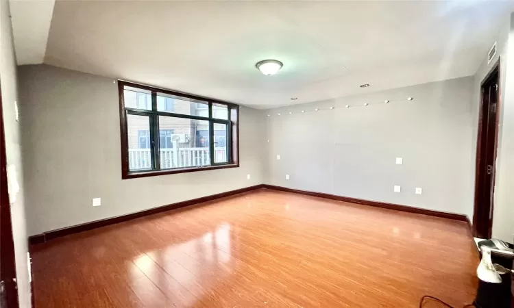 Unfurnished room featuring wood-type flooring