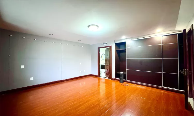 Empty room featuring wood-type flooring