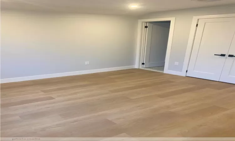 Empty room featuring light hardwood / wood-style flooring