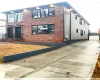 View of home's exterior featuring a garage and an outdoor structure