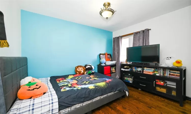 Bedroom featuring dark hardwood / wood-style floors