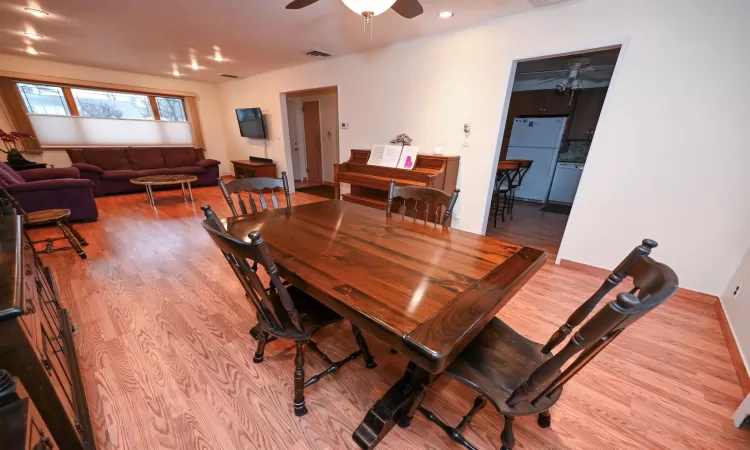 Dining room featuring ceiling fan and light hardwood / wood-style floors