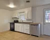 Empty room featuring radiator and dark hardwood / wood-style flooring