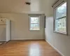 Staircase with hardwood / wood-style floors and lofted ceiling