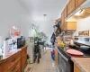 Kitchen featuring washer / dryer, electric stove, and light tile patterned floors