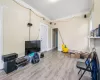 Misc room featuring light hardwood / wood-style floors and crown molding