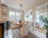 Tiled dining space with breakfast area, a healthy amount of sunlight, and ornamental molding